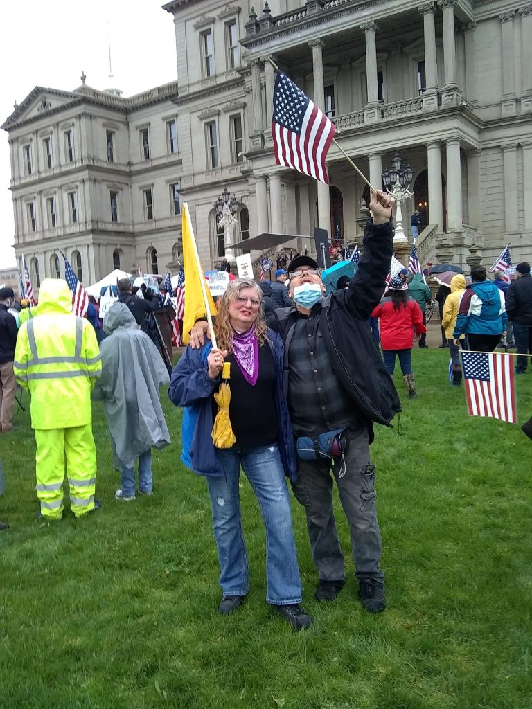 People take part in a protest for Michiganders Against Excessive Quarantine at the Capitol in Lansing, Mich., on May 14,2020, "Stand Up Michigan" sponsored this event. photo/video courtesy Bobby Powell, Michigan.