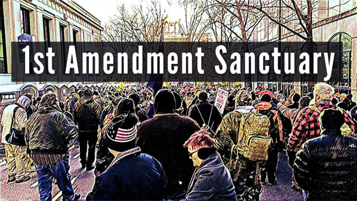 Picture showing a Pro Second Amendment Rally - Text reads: !st Amendment Sanctuary