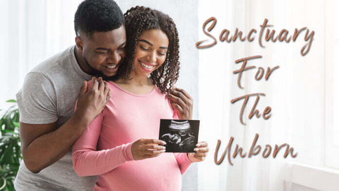 Picture of a mother holding an ultrasound while father hugs mother- text reads: Sanctuary for the Unborn